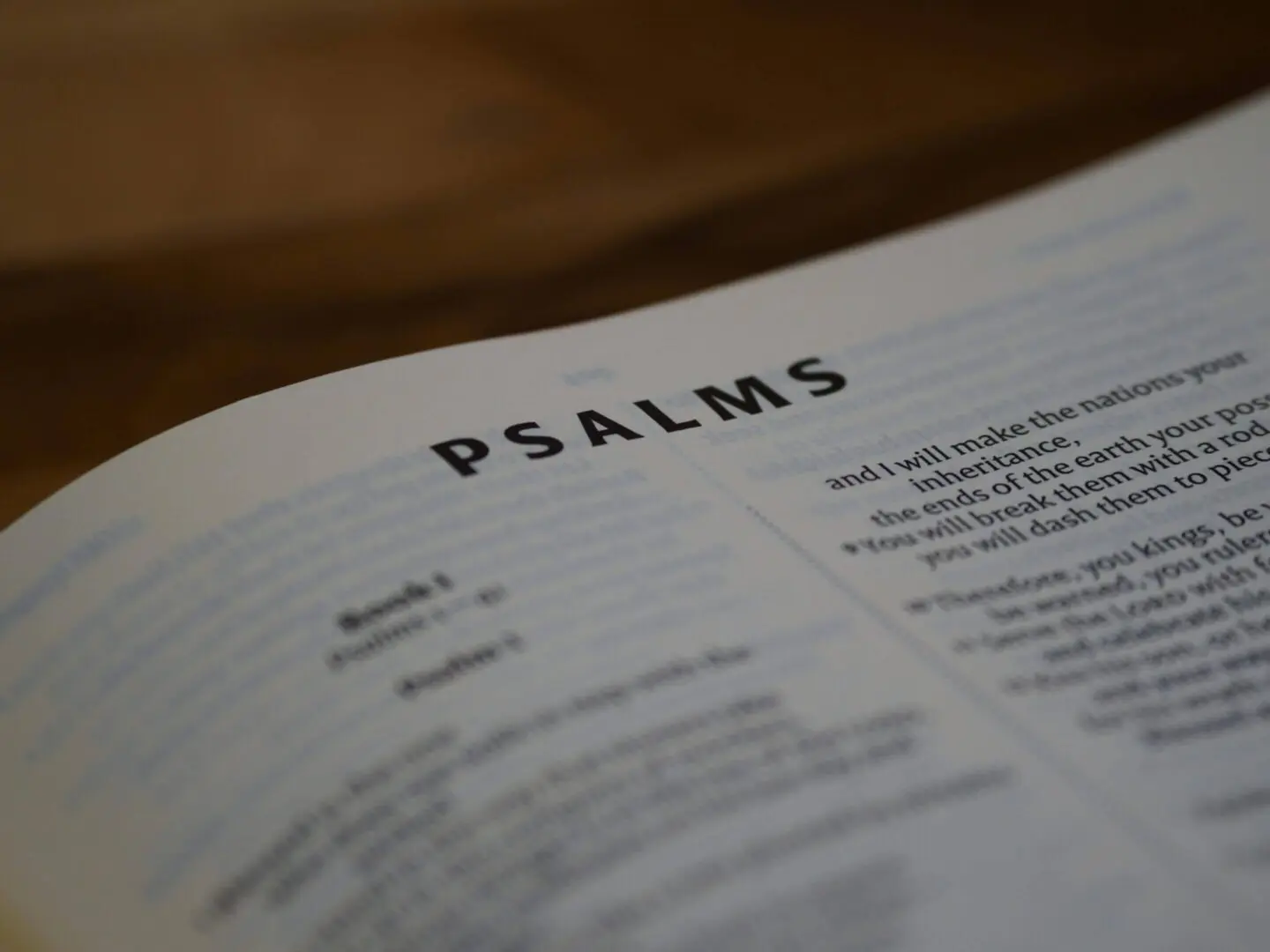 Open Bible showing the book of Psalms with a warm focus.