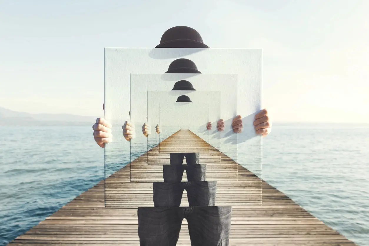 Surreal image of a man with a hat on a pier, repeated in transparent frames.