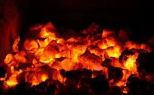 Glowing red-hot embers emitting intense heat.