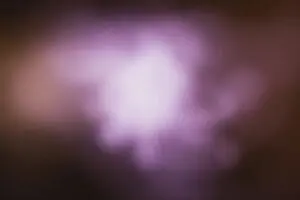 Blurred purple and white light creating a soft, dreamy effect.