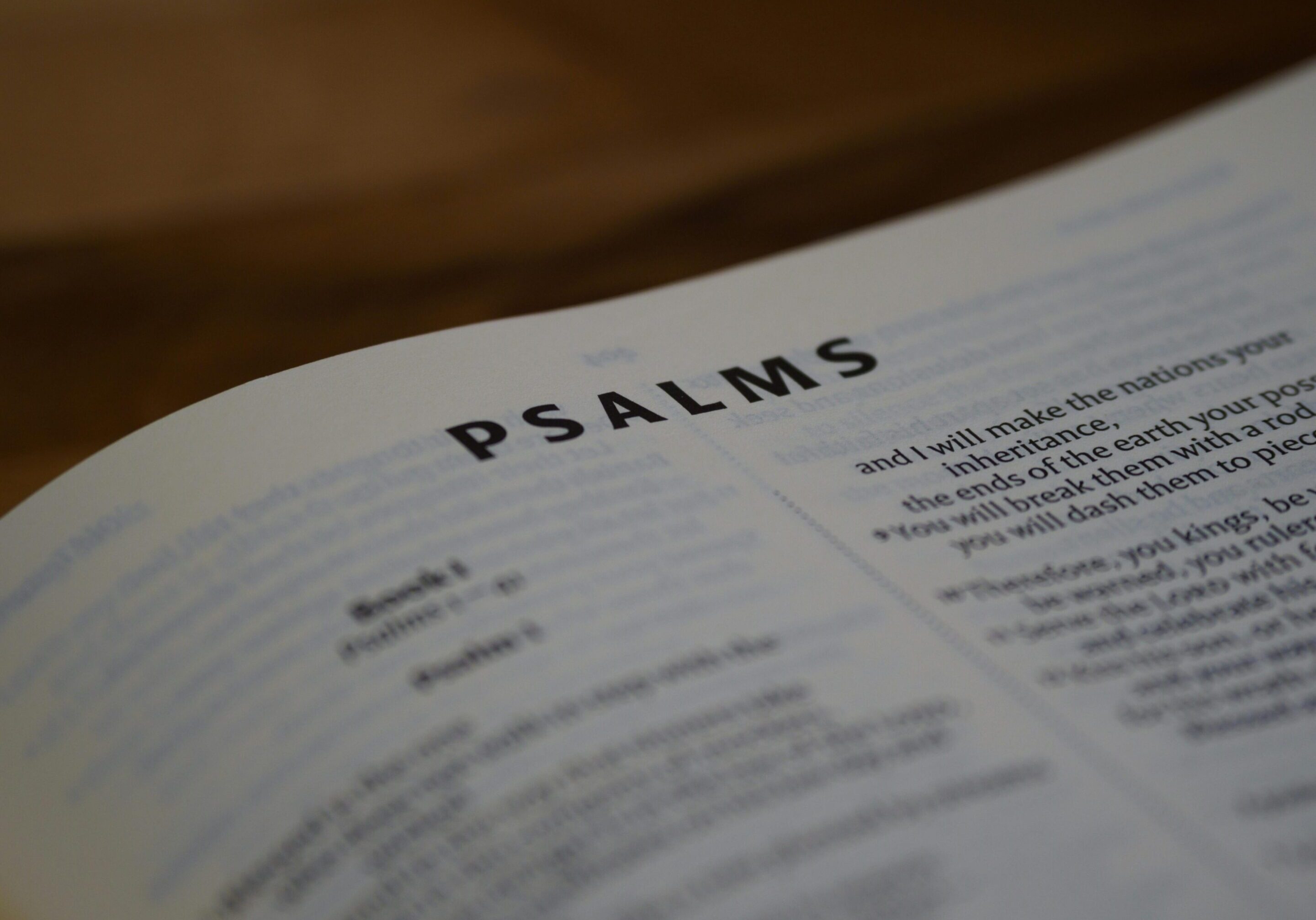 Open Bible showing the book of Psalms with a warm focus.