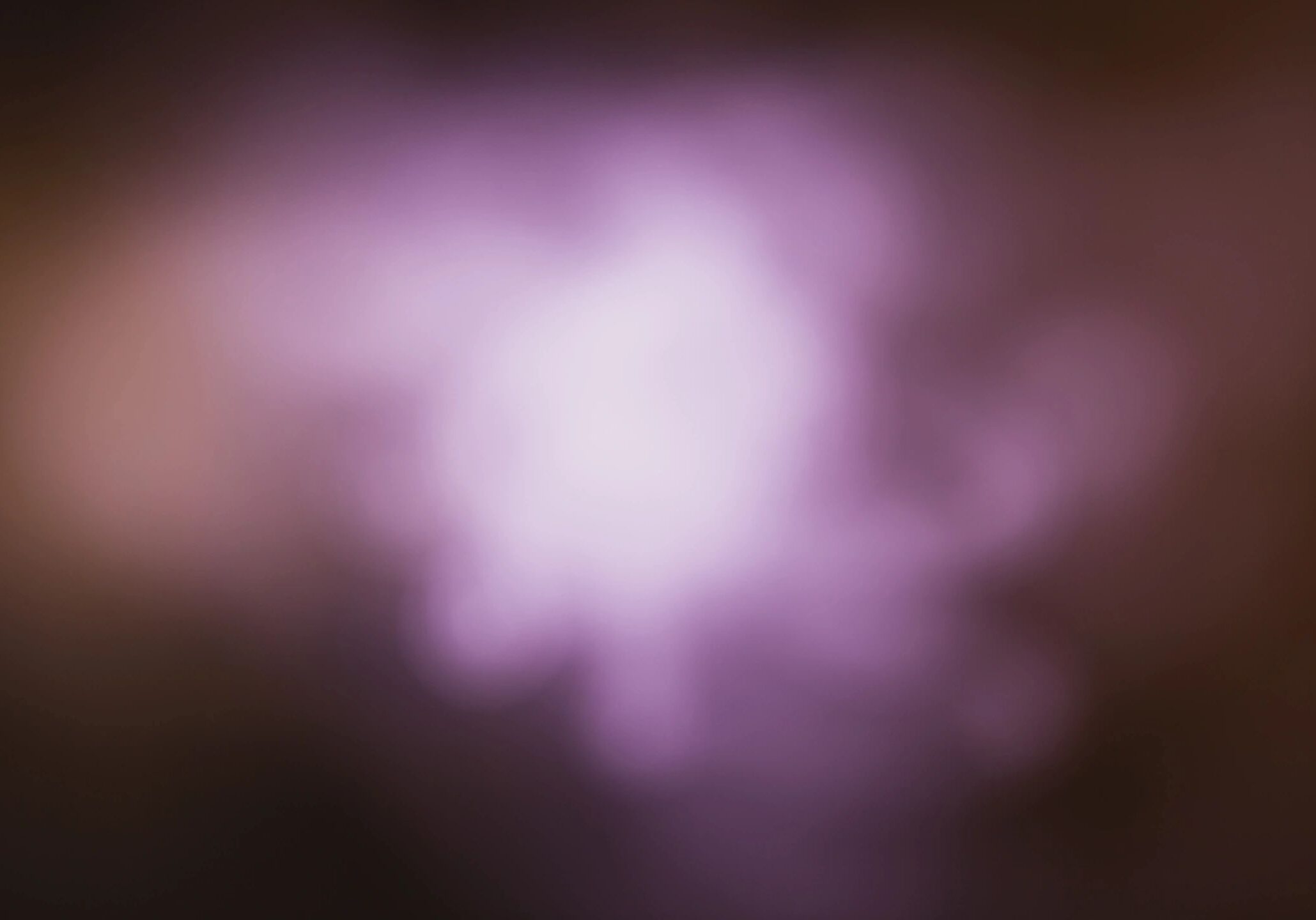 Blurred purple and white light creating a soft, dreamy effect.